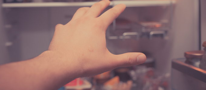 hand reaching for fridge